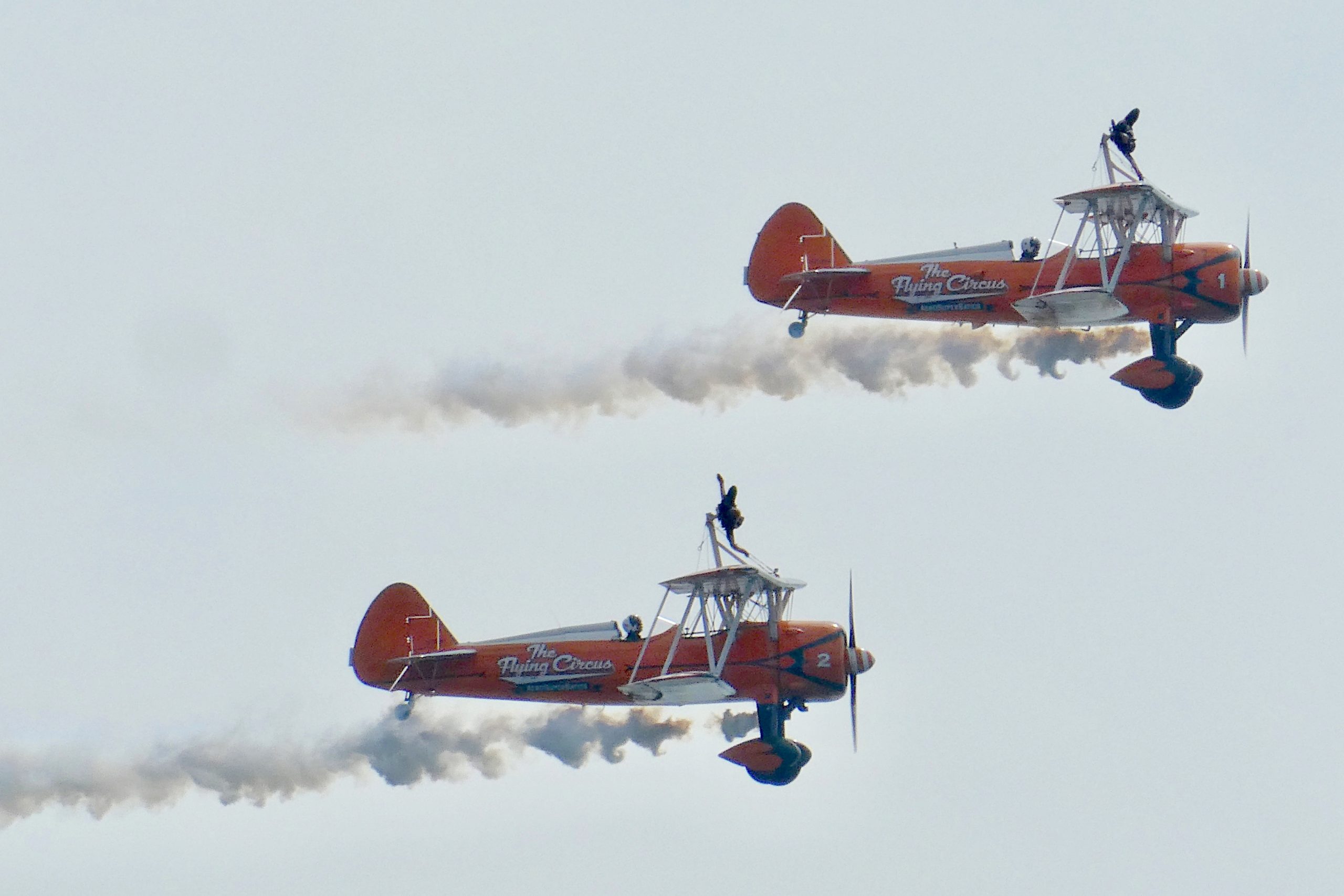 Stuntpeople on top of a plane demonstrating trust in pilots
